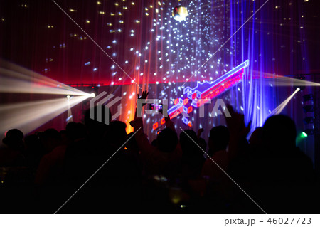 Blurred concept at concert party with audience and colourful led lighting. Blurred concept at concert party with audience and colourful led lighting. 46027723