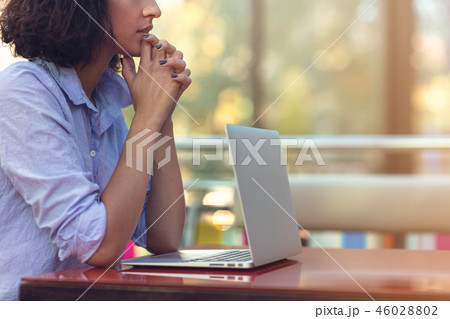 Stressed hipster businesswoman working on laptop in her office 46028802