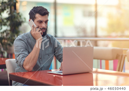 Excited happy bearded freelancer reading email with results about victory in modern online contest Excited happy bearded freelancer reading email with results about victory in modern online contest 46030440