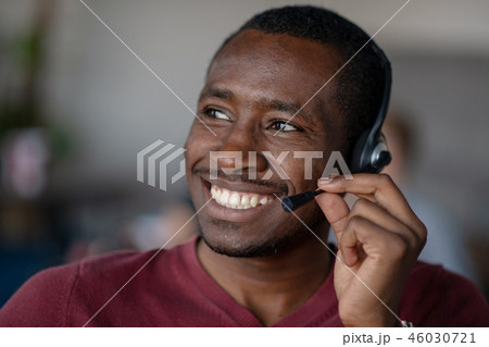 Emotional dark skinned male freelancer celebrating completed project successfully. Emotional dark skinned male freelancer celebrating completed project successfully. 46030721