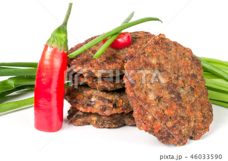 liver pancakes or cutlets with chili pepper and green onions isolated on white background liver pancakes or cutlets with chili pepper and green onions isolated on white background 46033590