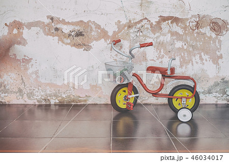 Retro Style Children Tricycle in the Kindergarten. Retro Style Children Tricycle in the Kindergarten. 46034017