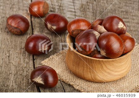 chestnut in wooden bowl on old wooden background chestnut in wooden bowl on old wooden background 46035939