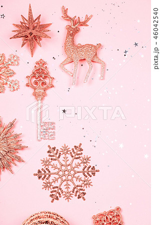 Golden beautiful sparkling christmas decorative toys on pastel pink background. 46042540