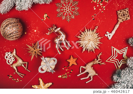 Wonderful different sparkling Christmas decorative toys on red background. 46042617