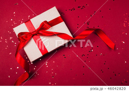 Craft gift box with red bow Craft gift box with red bow 46042820