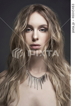 Young beautiful blonde with silver necklace 46045463