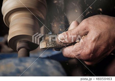 Closeup hand of the Carpenter lathing wood.  46050463