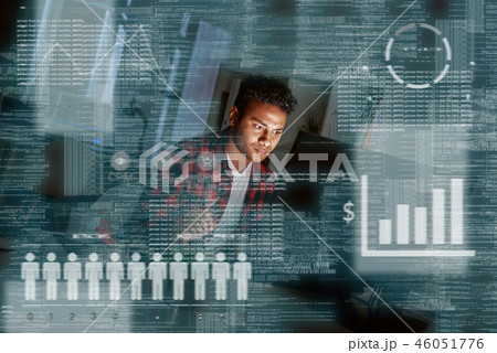 Young concentrated indian PPC specialist looking over advertising conversion 46051776