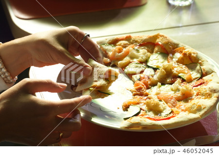 pizza in a plate on the restaurant table 46052045