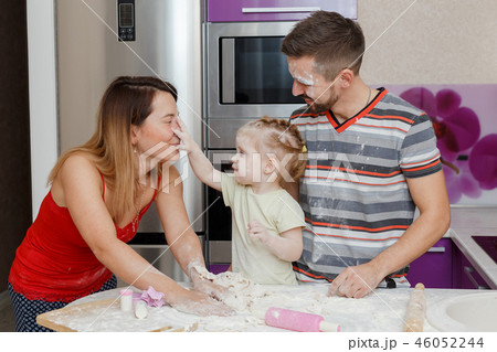 Family making dough at home kitchen 46052244