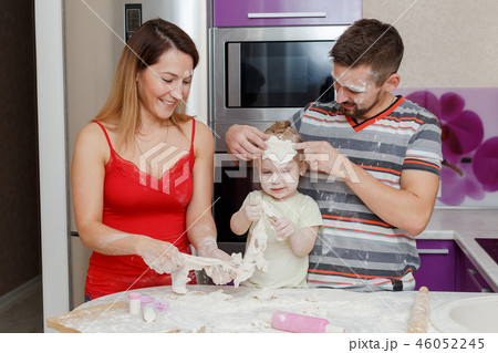 Family making dough at home kitchen Family making dough at home kitchen 46052245