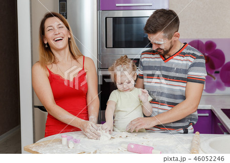 Family making dough at home kitchen Family making dough at home kitchen 46052246
