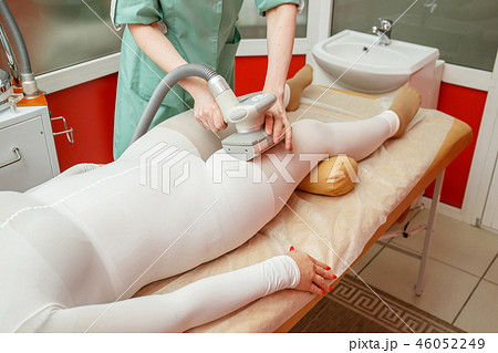 Woman having anti cellulite lpg massage Woman having anti cellulite lpg massage 46052249