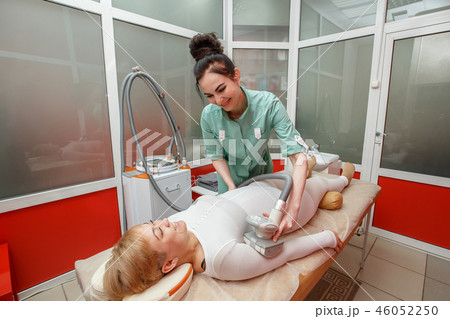 Woman having anti cellulite lpg massage Woman having anti cellulite lpg massage 46052250
