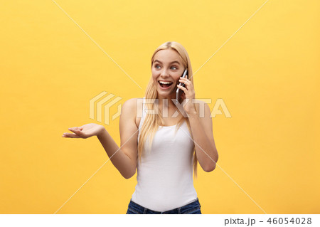 Image of gorgeous woman in casual being surprised or excited to receive pleasant talk on her cell Image of gorgeous woman in casual being surprised or excited to receive pleasant talk on her cell 46054028