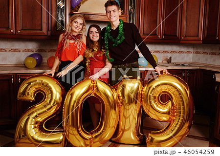 New 2019 Year is coming. Group of cheerful New 2019 Year is coming. Group of cheerful 46054259
