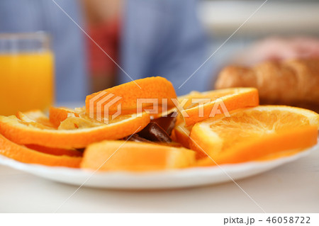 Orange sliced slices on a plate on a kitchen 46058722