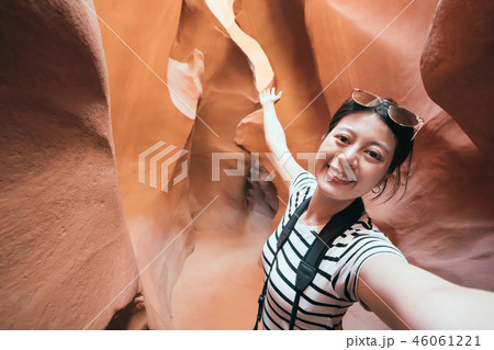 asian lady taking selfie showing the amazing view asian lady taking selfie showing the amazing view 46061221