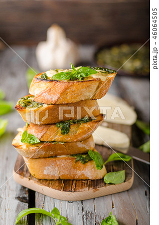 Garlic herbs toast with fresh mozzarella Garlic herbs toast with fresh mozzarella 46064505