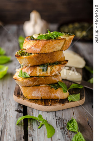 Garlic herbs toast with fresh mozzarella 46064530