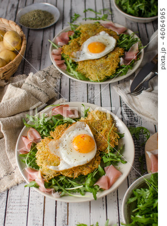 Potato pancakes with eggs and ham 46064965