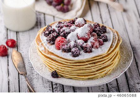 Homemade crepes with frozen berries, topped sugar 46065088