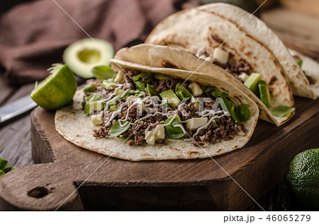 Homemade minced beef tortilla, fresh avocado and mozarella cheese Homemade minced beef tortilla, fresh avocado and mozarella cheese 46065279