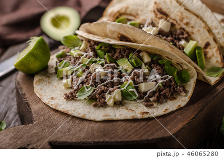 Homemade minced beef tortilla, fresh avocado and mozarella cheese Homemade minced beef tortilla, fresh avocado and mozarella cheese 46065280