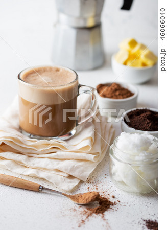 KETOGENIC KETO DIET DRINK. Coffe and cacao blended with coconut oil. Cup of bulletproof coffe with KETOGENIC KETO DIET DRINK. Coffe and cacao blended with coconut oil. Cup of bulletproof coffe with 46066040