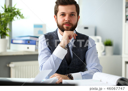 Handsome smiling bearded clerk man at office workplace 46067747