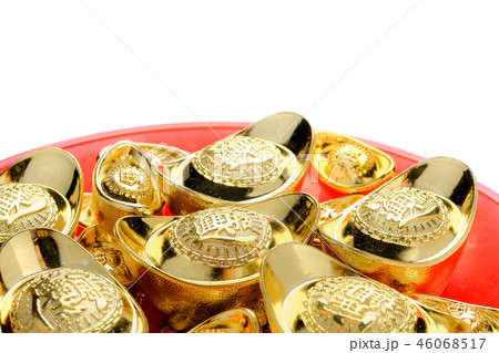 group of golden ingot on red tray isolate at white 46068517