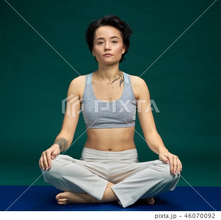 Pretty woman doing yoga exercise 46070092