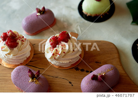 Purple fruit mousse cake, meringue Anna Pavlova on a wooden Board.Culinary art 46071707