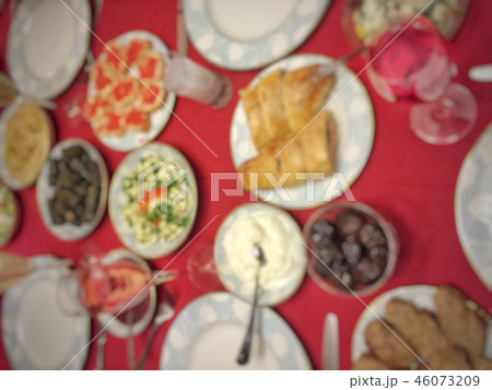 blurred background with table full of food blurred background with table full of food 46073209