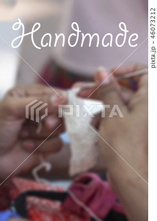 Blurred background with hands doing needlework Blurred background with hands doing needlework 46073212