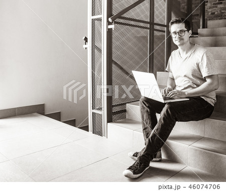 young freelancer man using laptop computer 46074706
