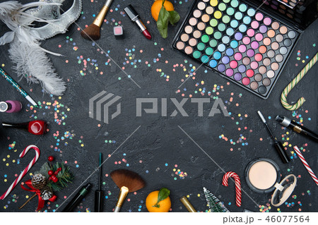 Picture from above of accessories for makeup artist, mandarin, Christmas fir, sugar cane 46077564