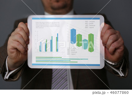 Businessman holding tablet in hands with 46077860