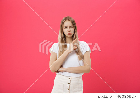 Shot of bored annoyed beautiful teenage girl with straight blond hair looking at camera with boring Shot of bored annoyed beautiful teenage girl with straight blond hair looking at camera with boring 46080927