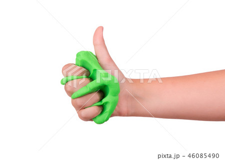 The child crushes the slime in his hand.  46085490