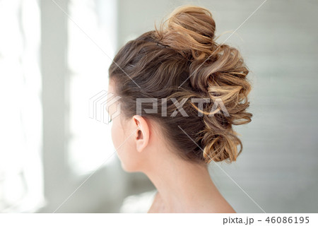 Hair Styling Rear View, Brown color Iroquois hair style on background. 46086195