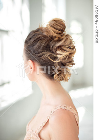 Hair Styling Rear View, Brown color Iroquois hair style on background. Hair Styling Rear View, Brown color Iroquois hair style on background. 46086197