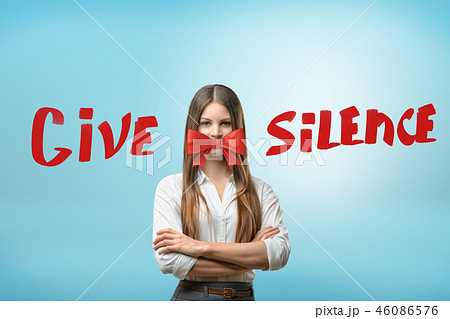 A young woman, arms folded, with a beautiful red bow covering her mouth and the title 'Give Silence 46086576