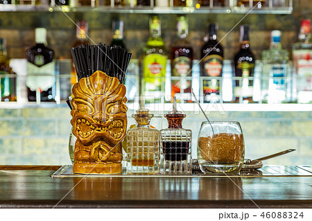 a glass tiki on the bar 46088324