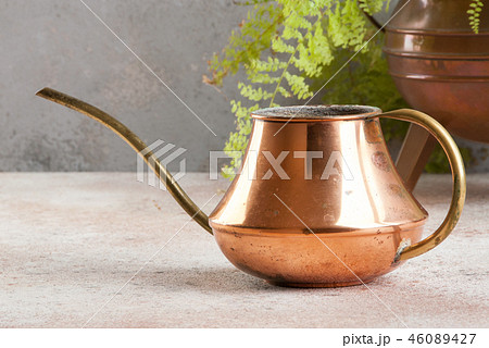Old copper watering can Old copper watering can 46089427