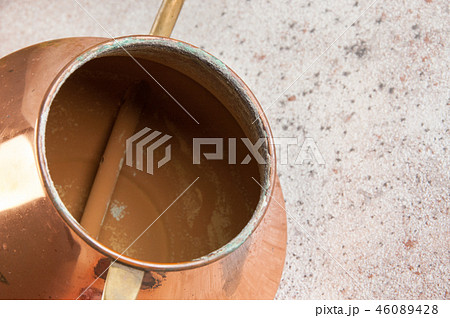 Old copper watering can Old copper watering can 46089428