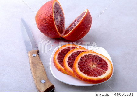 Orange fruit. Orange and lemon slice on white plate. Top view. Orange fruit. Orange and lemon slice on white plate. Top view. 46091531