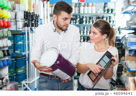 Couple choosing paint in household store 46094641