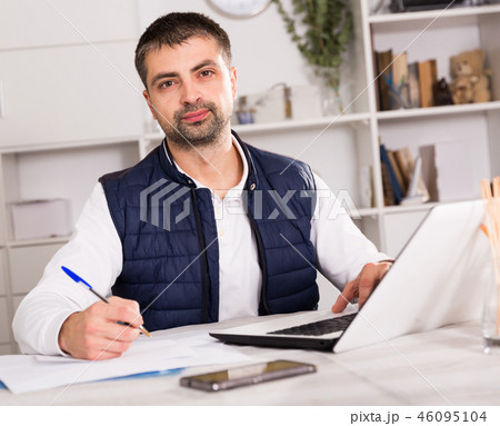 Portrait of male business working in office with laptop Portrait of male business working in office with laptop 46095104